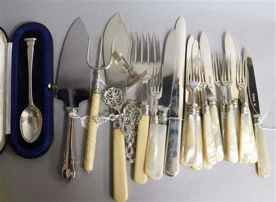 Six pairs of late Victorian mother of pearl handled silver fruit eaters, a pair of fish servers, four spoons by William Comyns etc.